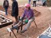 Shaving horse & draw knife in opperation producing pointy sticks (bale spikes)