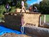 bales on top to form a ridge, planks on ends of joists to cover up sharp ends that may pierce tarpaulin.