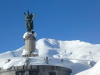 WW1 memorial at side of road, with a little snow on it.